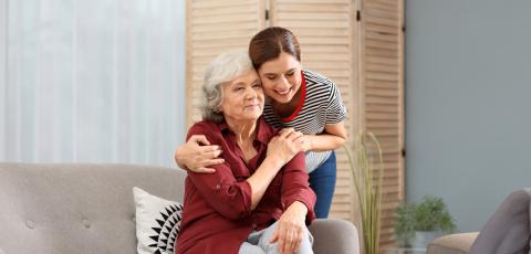older mother and daughter embracing