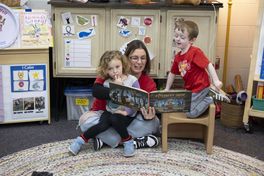 A MARC Head Start teacher reads to children