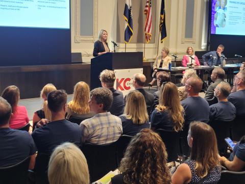 A crowd watching the World Cup briefing for elected officials